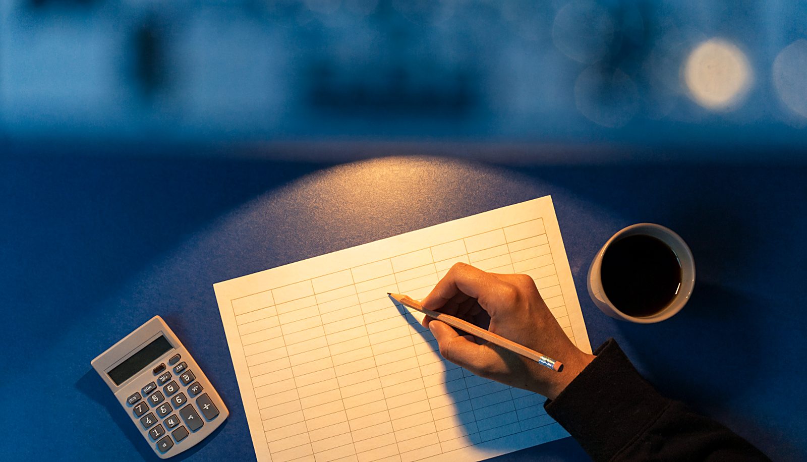 A 90-day money plan sketched out on paper, targets and dates marked in pencil